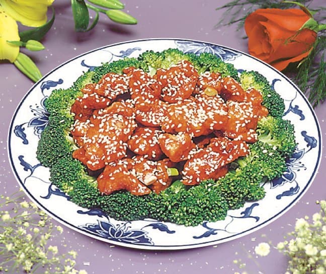 Golden Wok sesame chicken with broccoli on a blue and white plate
